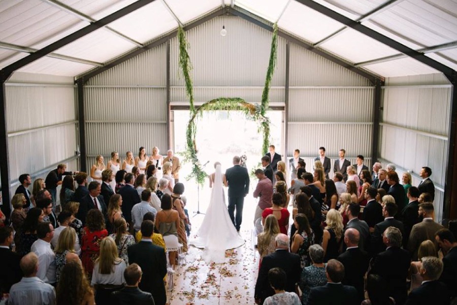 Wedding ceremony inside the Red Shed at Lake Lodge