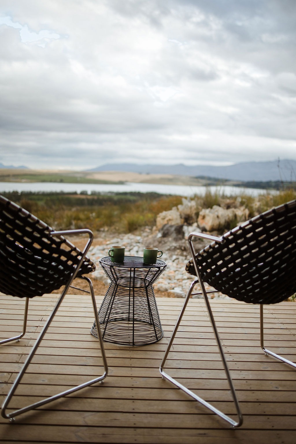Outdoor seating overlooking the Theewaterskloof Dam at Luna Pod