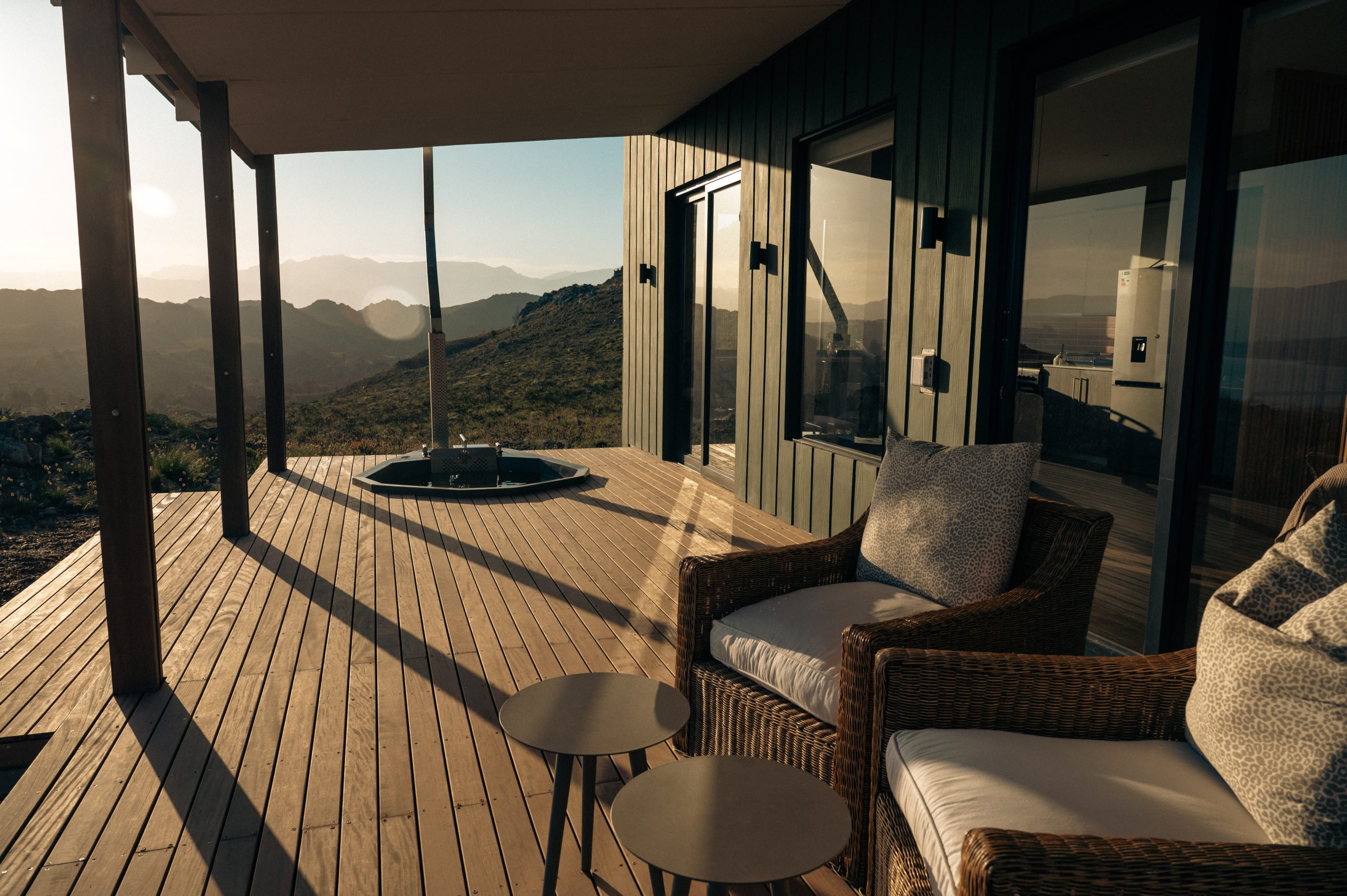 Covered deck and mountain view at Sola Pod
