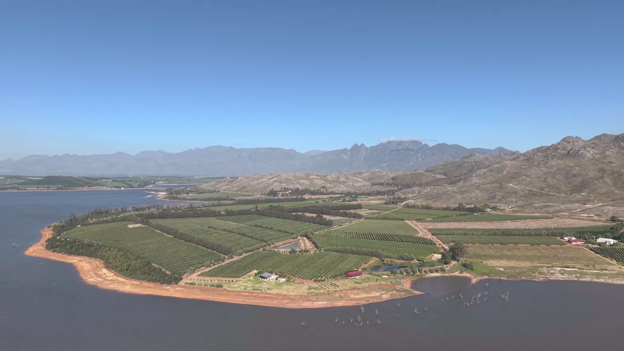 Aerial view over the Theewaterskloof Dam, orchards and mountains at Ebuta Collection